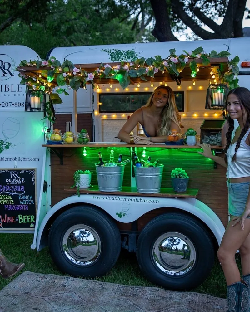 Double R bartender pouring a drink at a North Texas outdoor celebration