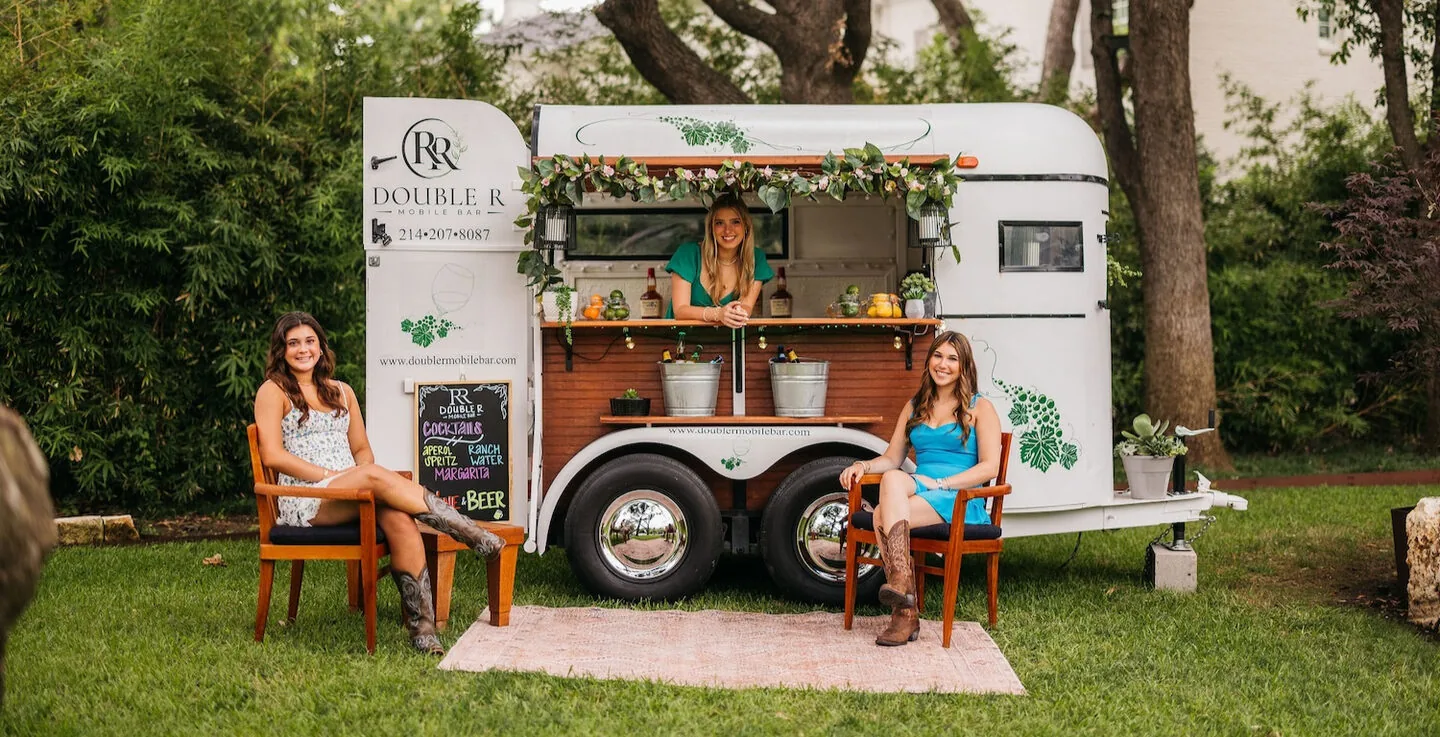 The Double R vintage horse trailer bar serving guests at a Dallas outdoor event