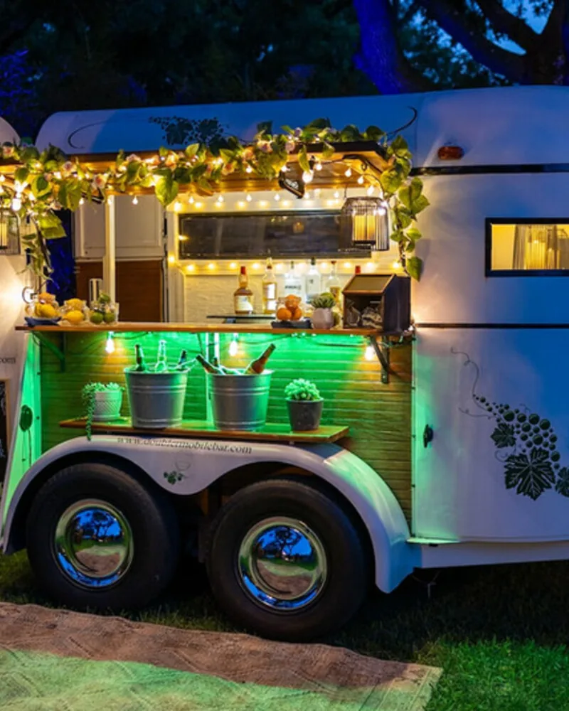 The Double R trailer lit up at a nighttime event